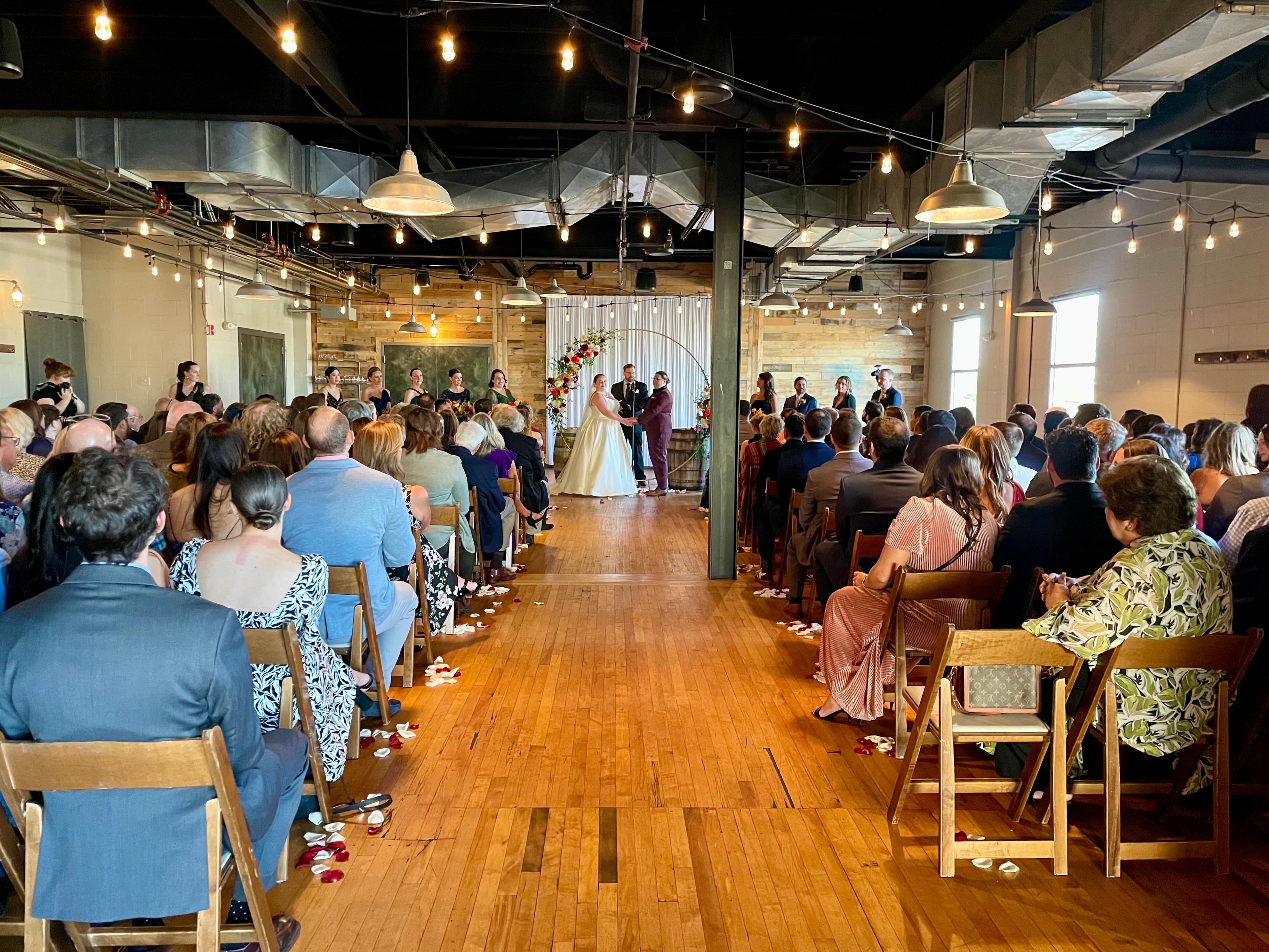 Industrial wedding ceremony setup at Beach Haus Brewery