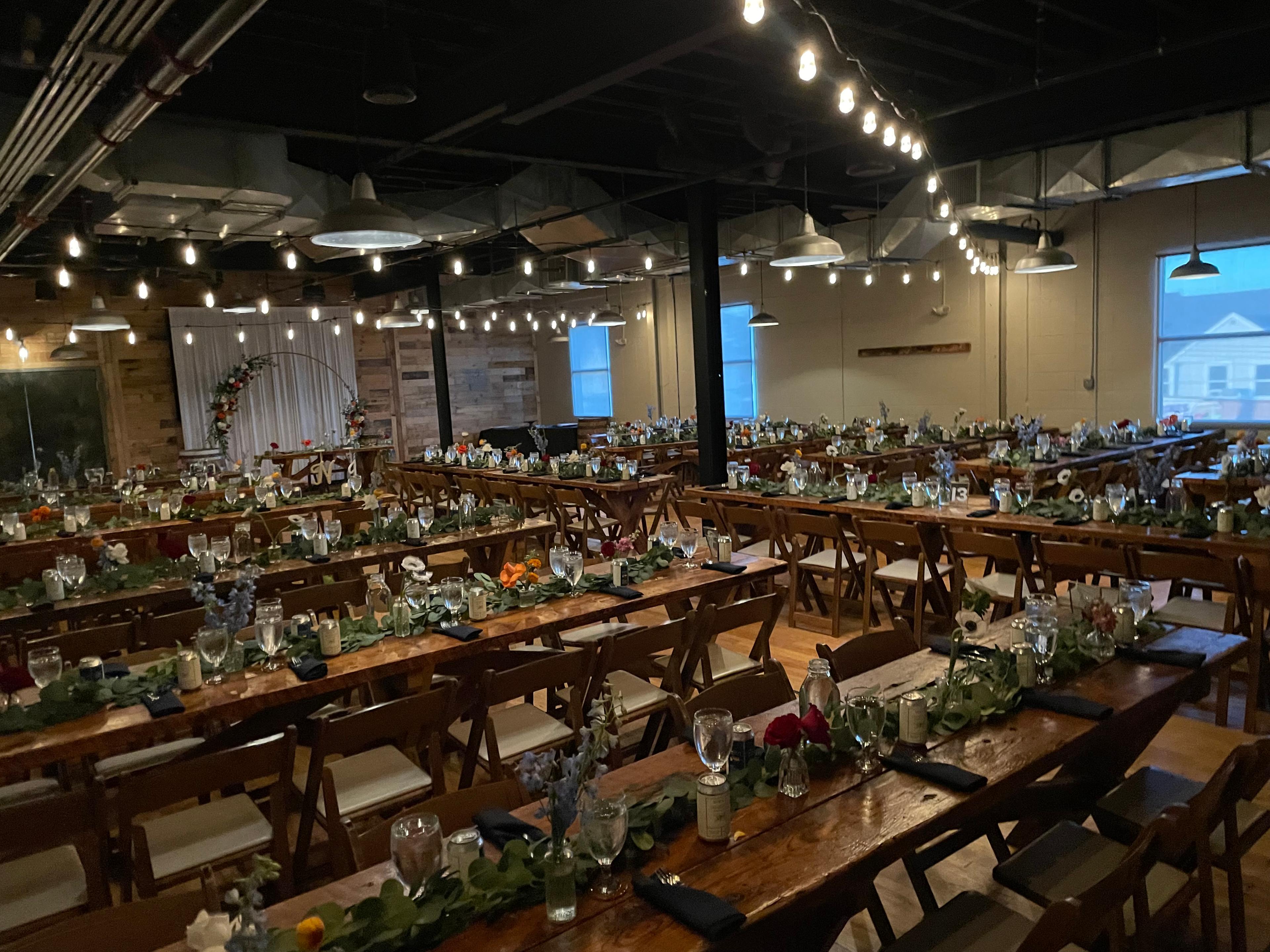 Rustic industrial wedding venue setup at Beach Haus Brewery